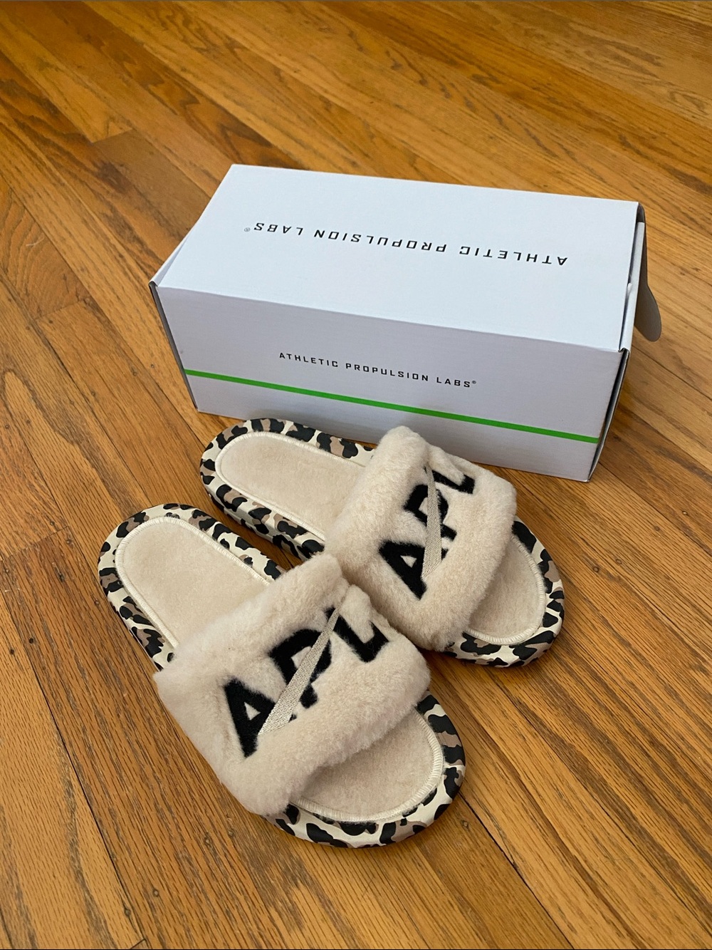 APL Athletic Propulsion Labs Shearling Slides in the Parchment/Black/Leopard